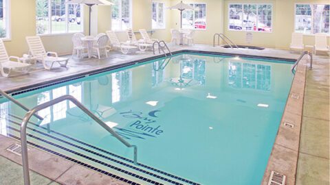A swimming pool at a Shelbyville Hotel, perfect for guests looking for things to do during their vacation in West Michigan to stay active.